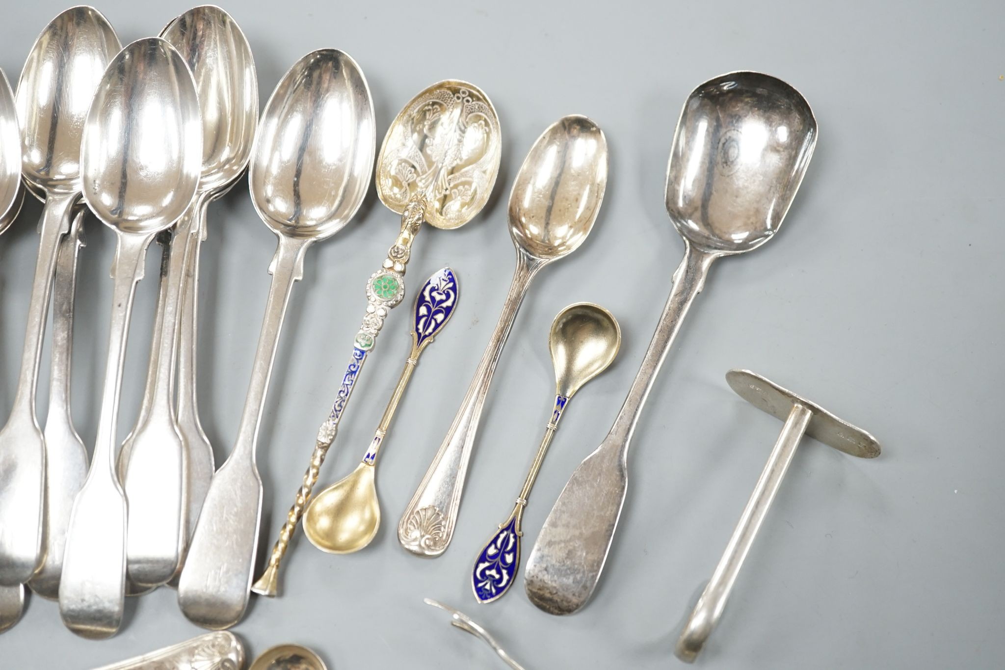 A set of twelve Victorian silver fiddle pattern teaspoons, London, 1870, a pair of Victorian sauce lades and a quantity of assorted sundry silver flatware